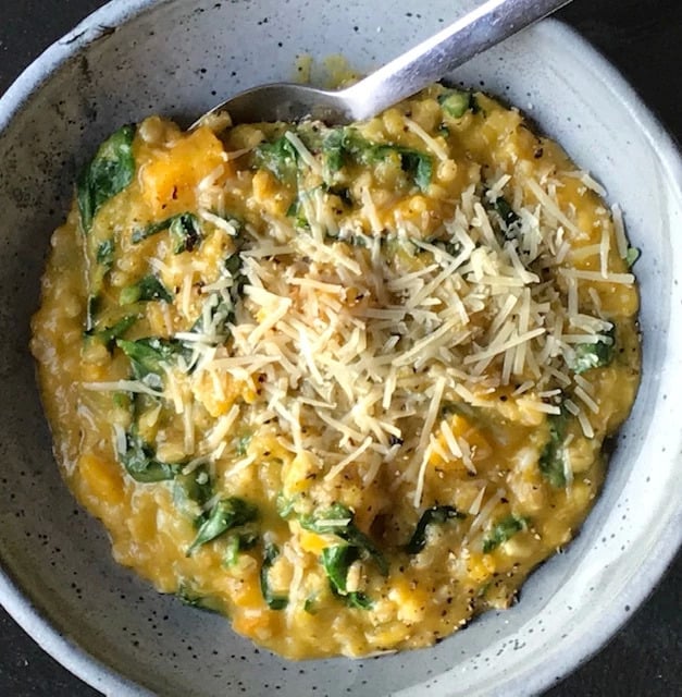 Bowl with Roast Pumpkin and Barley Risotto topped with Parmesan Cheese