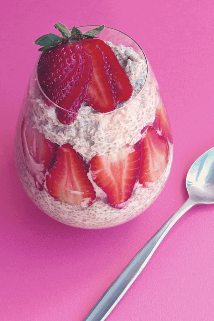 Chia seed pudding in a cup with strawberry slices