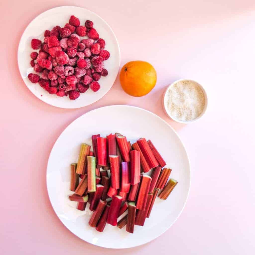plates with individual ingredients for stewed rhubarb and raspberries