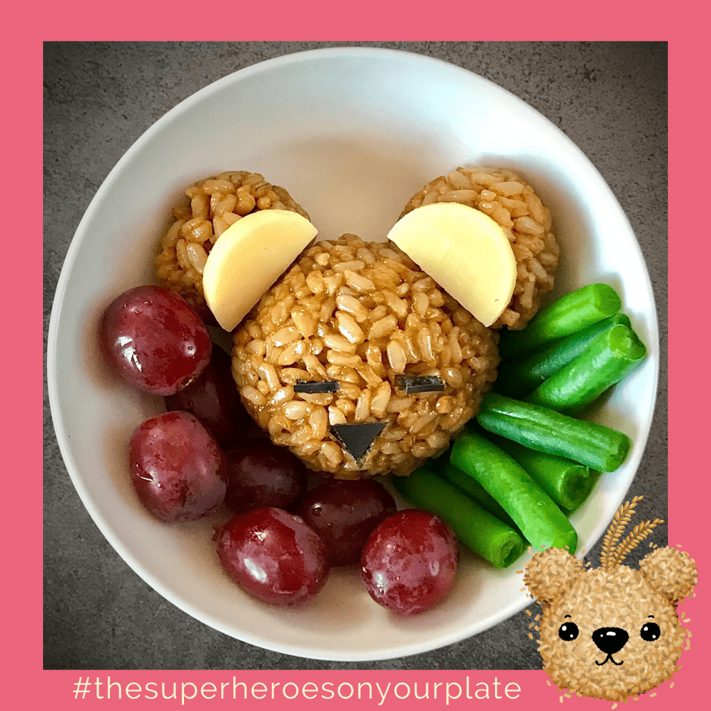 Brown rice bear in bowl with grapes and green beans