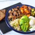 A grain bowl with brown rice or quinoa, a simple olive oil and lemon zest dressing, chicken sausage pieces and roasted sweet potatoes and Brussels sprouts.