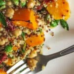 White plate with Pumpkin Quinoa Salad and a fork.