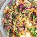 Asian sesame ginger slaw with quinoa in a glass bowl.